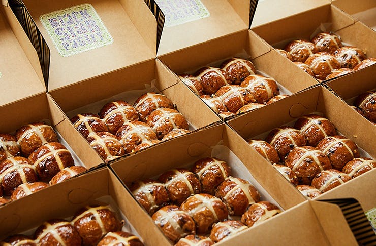 Dozens of hot cross buns in a row.