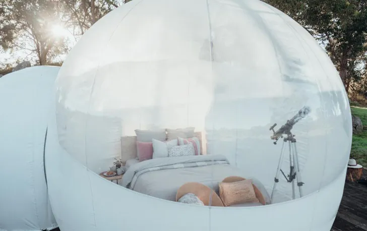 looking into the bubble tent with a queen bed inside