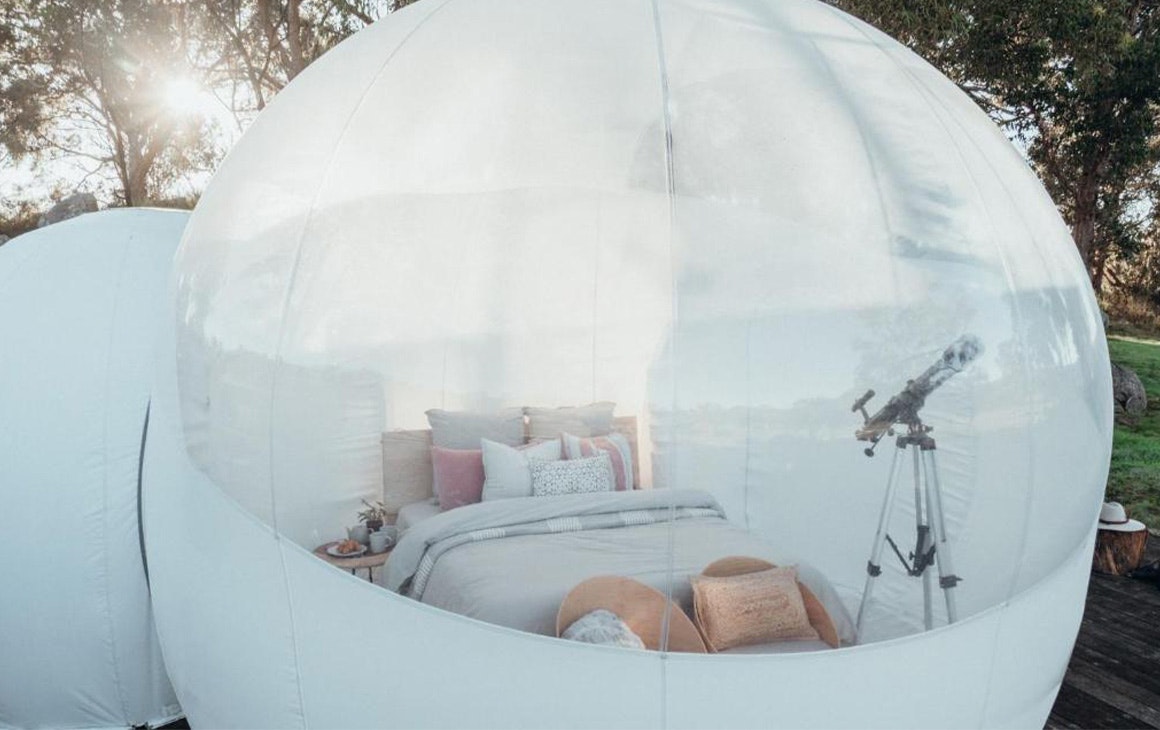 looking into the bubble tent with a queen bed inside
