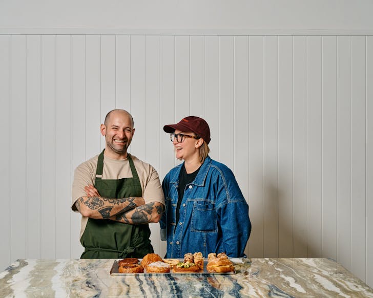 John Demetrios and his wife Martine, owner's of Butter Days Bakery, pictured in front of a try of baked goods