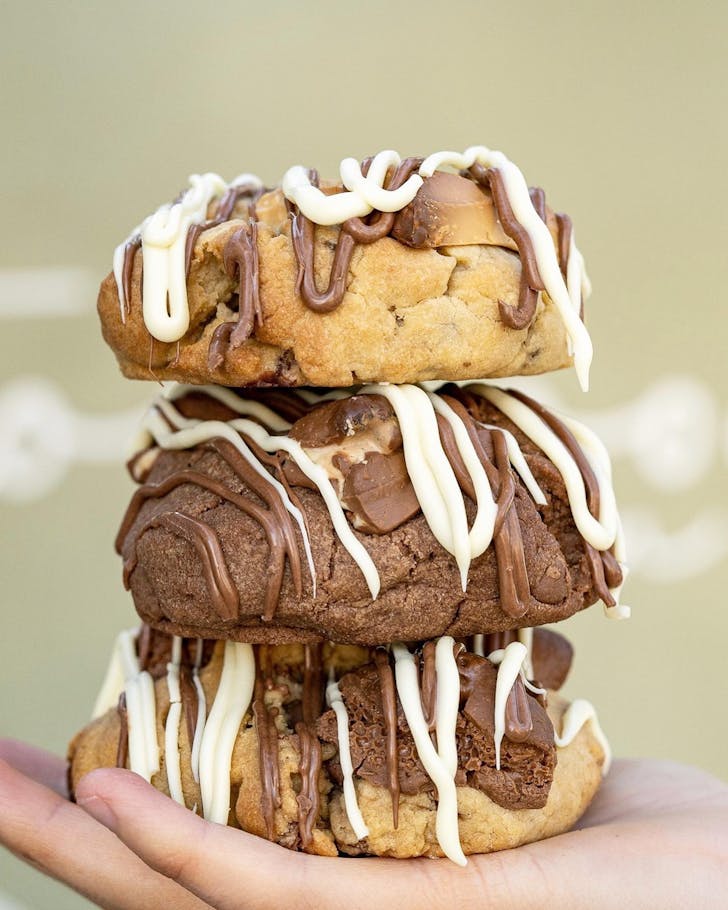 Someone holding cookies at Too Good n Co cafe in Joondalup