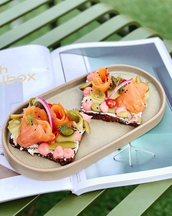 A salmon breakfast dish at Dine By Arrival Hall cafe in Northbridge, Perth