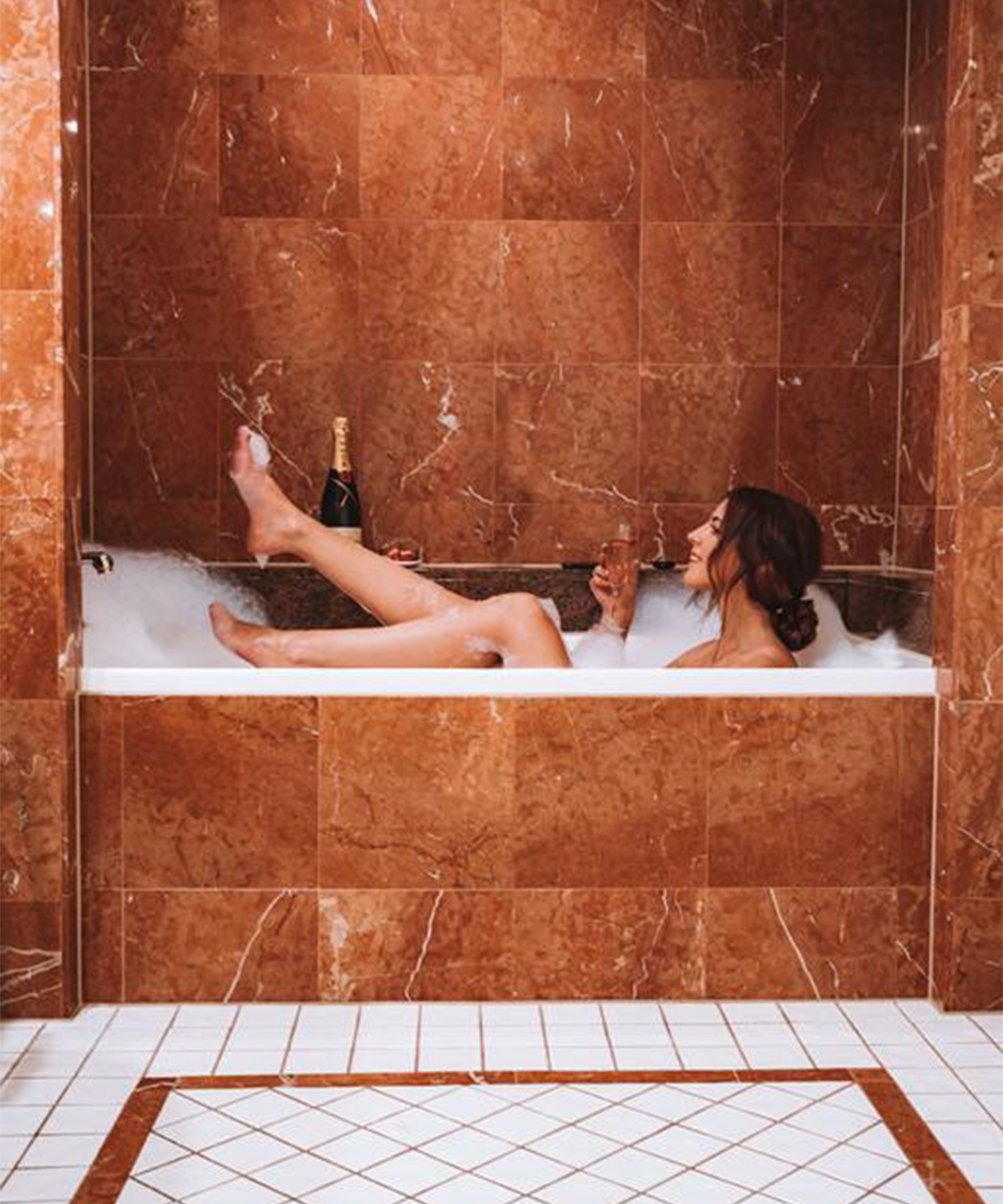 a woman in a bubble bath