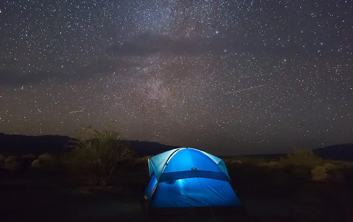 A tent under a sky full of stars