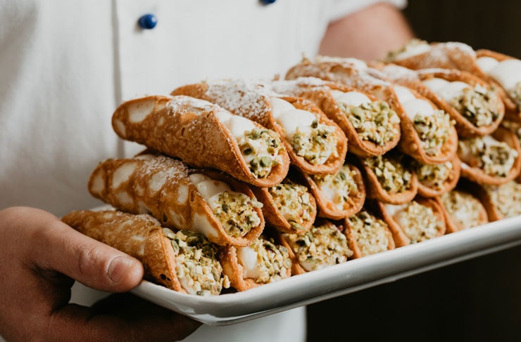 A tray of fresh cannoli.