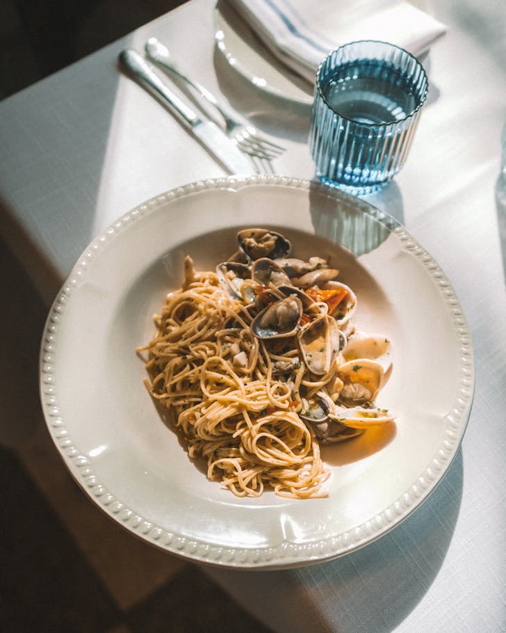 Seafood marinara on a decorative white bowl