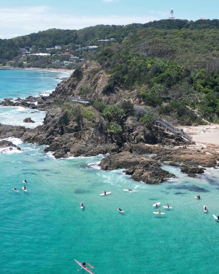 A group of surfers on The Pass along the Cape Byron Track