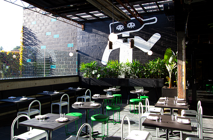 Several tables in a courtyard.