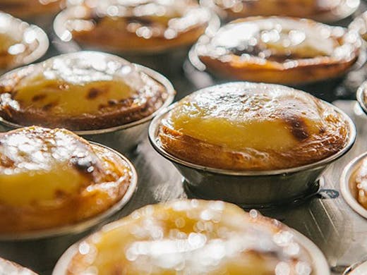 Freshly baked Portuguese tarts in the oven from Casa Nata.