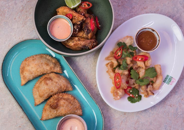 plates of empanadas, wings and ceviche