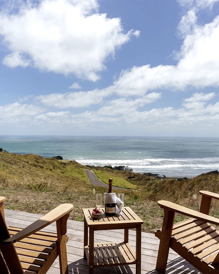 Two chairs overlooking at view at Castaways one of the best romantic stays near Auckland