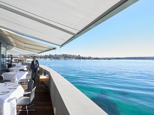 The sunny deck with water views at Catalina in Sydney