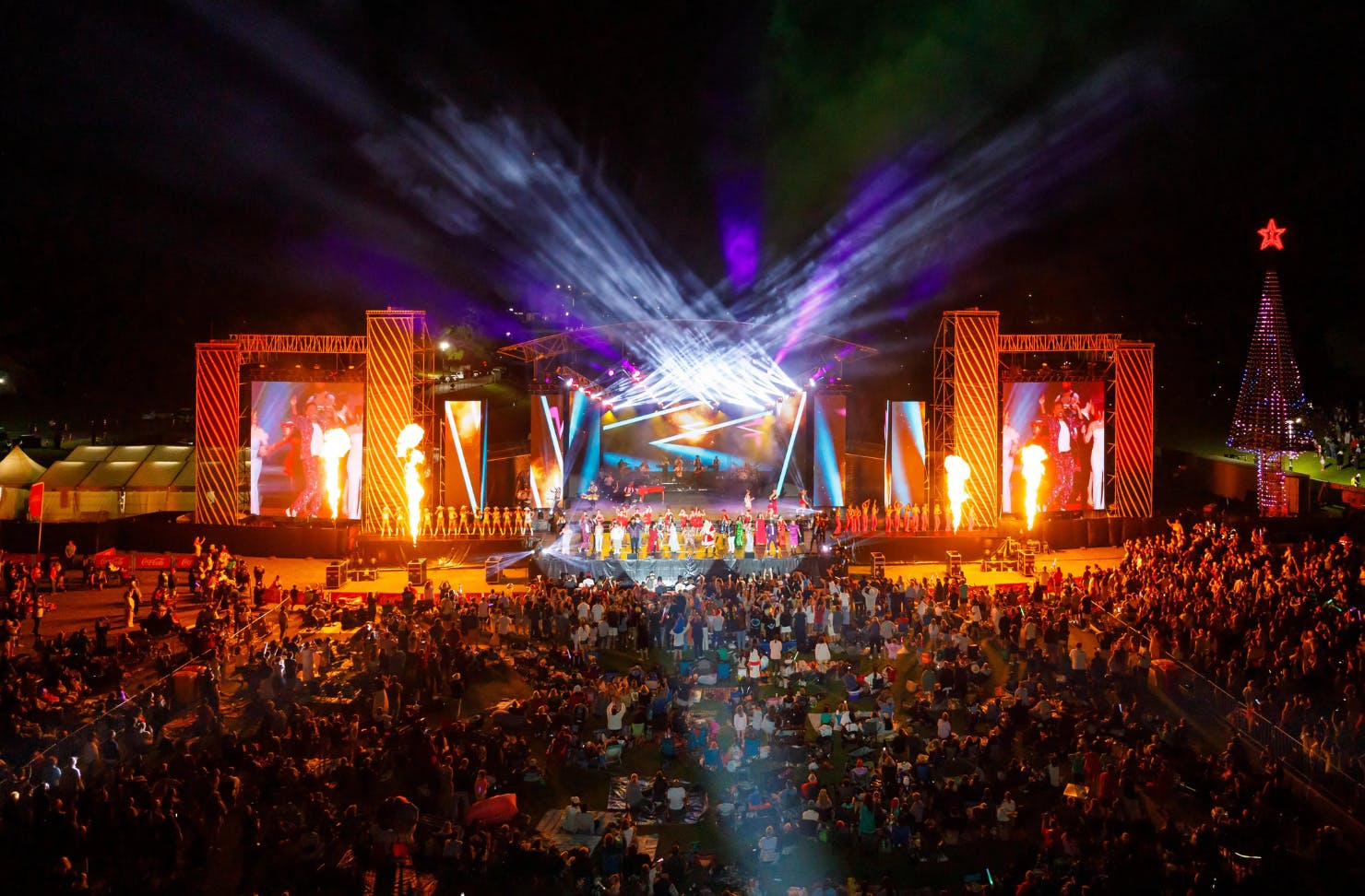 A massive, extravagant, lit-up stage at Coca Cola Christmas in the Park.