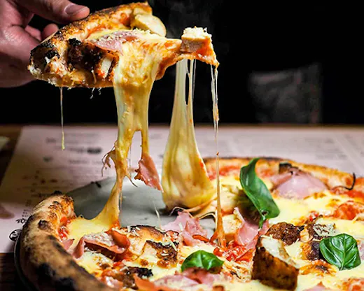 A cheesy parmigiana pizza.