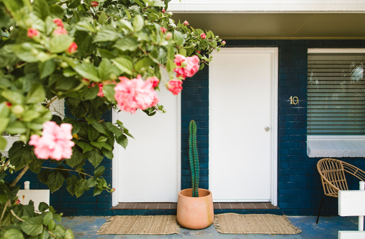 The blue and white exterior of a revamped retro motel in Brunswick Heads, NSW.