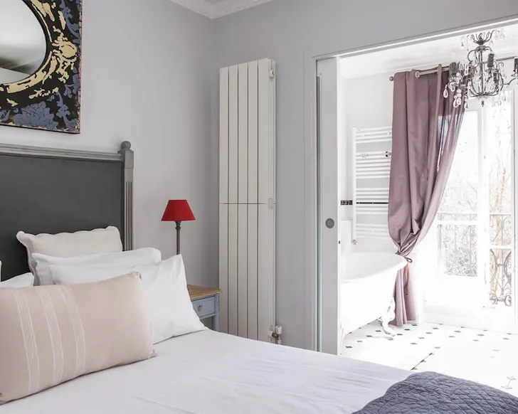 Bedroom inside airbnb with eiffel tower views