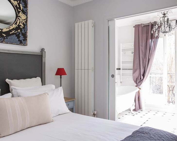 Bedroom inside airbnb with eiffel tower views