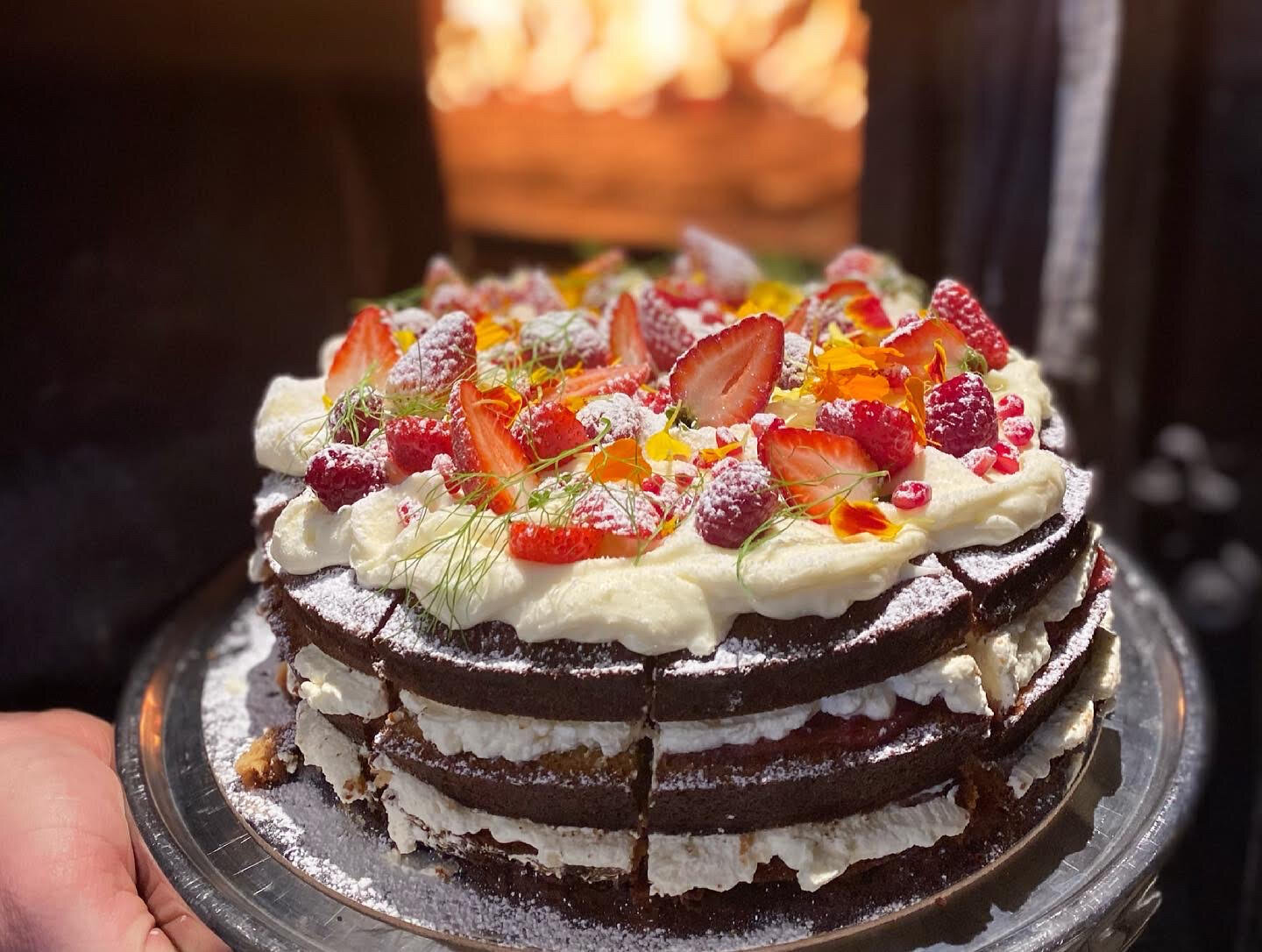 cake with cream and fruit on top