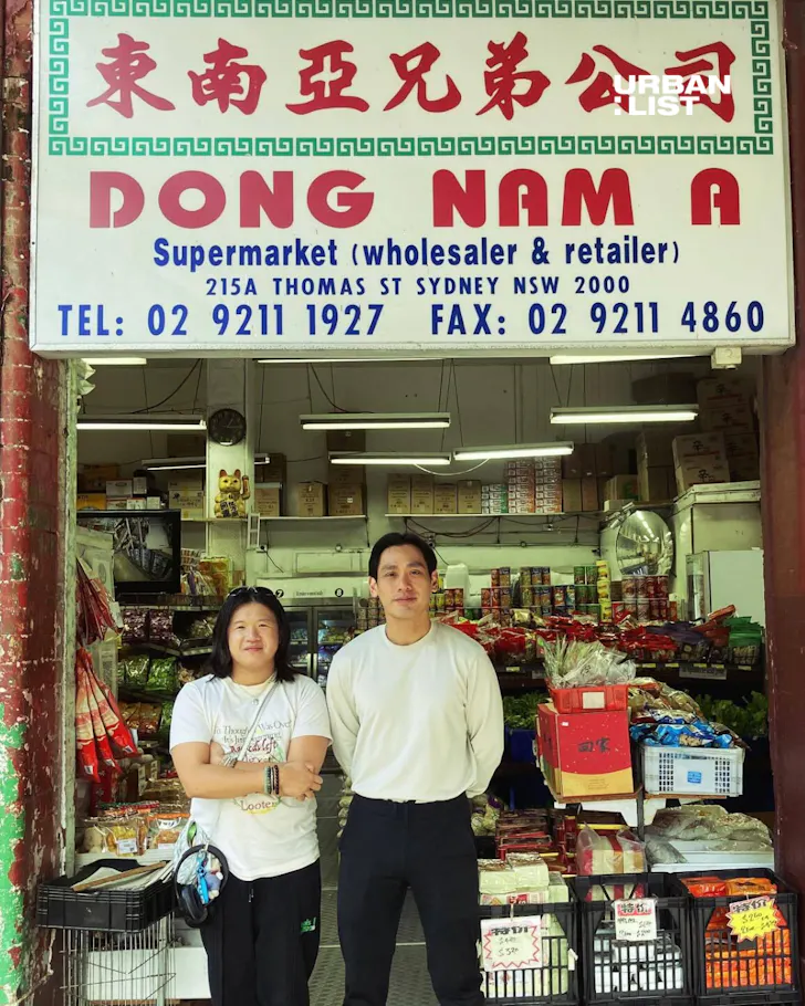 Owners of Dong Nam A Brothers & Co outside their Chinatown grocer.