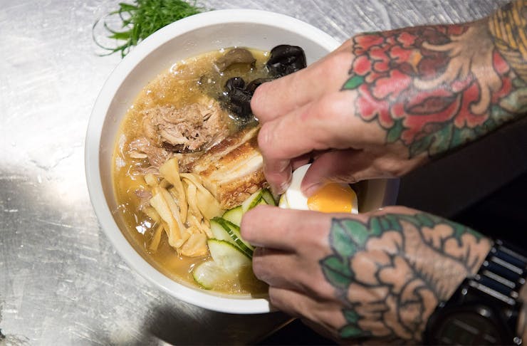 The chef assembles a delicious bowl of ramen at Auckland's Chop Chop Noodle House.