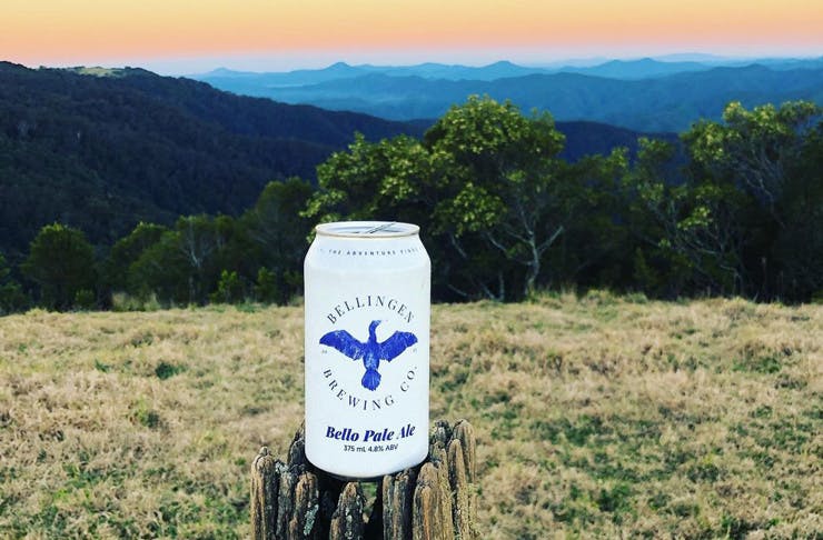 A Bellingen Beer Co beer can with green hills and a sunset in the background. 