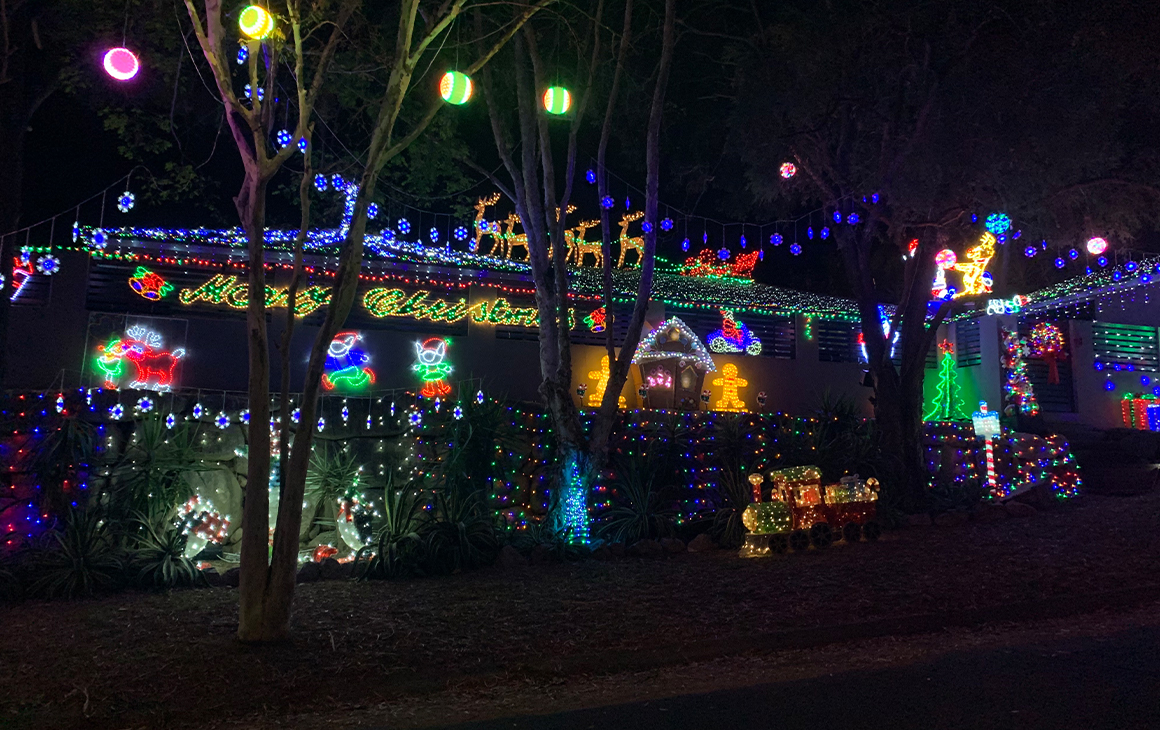 a house lit by Christmas lights