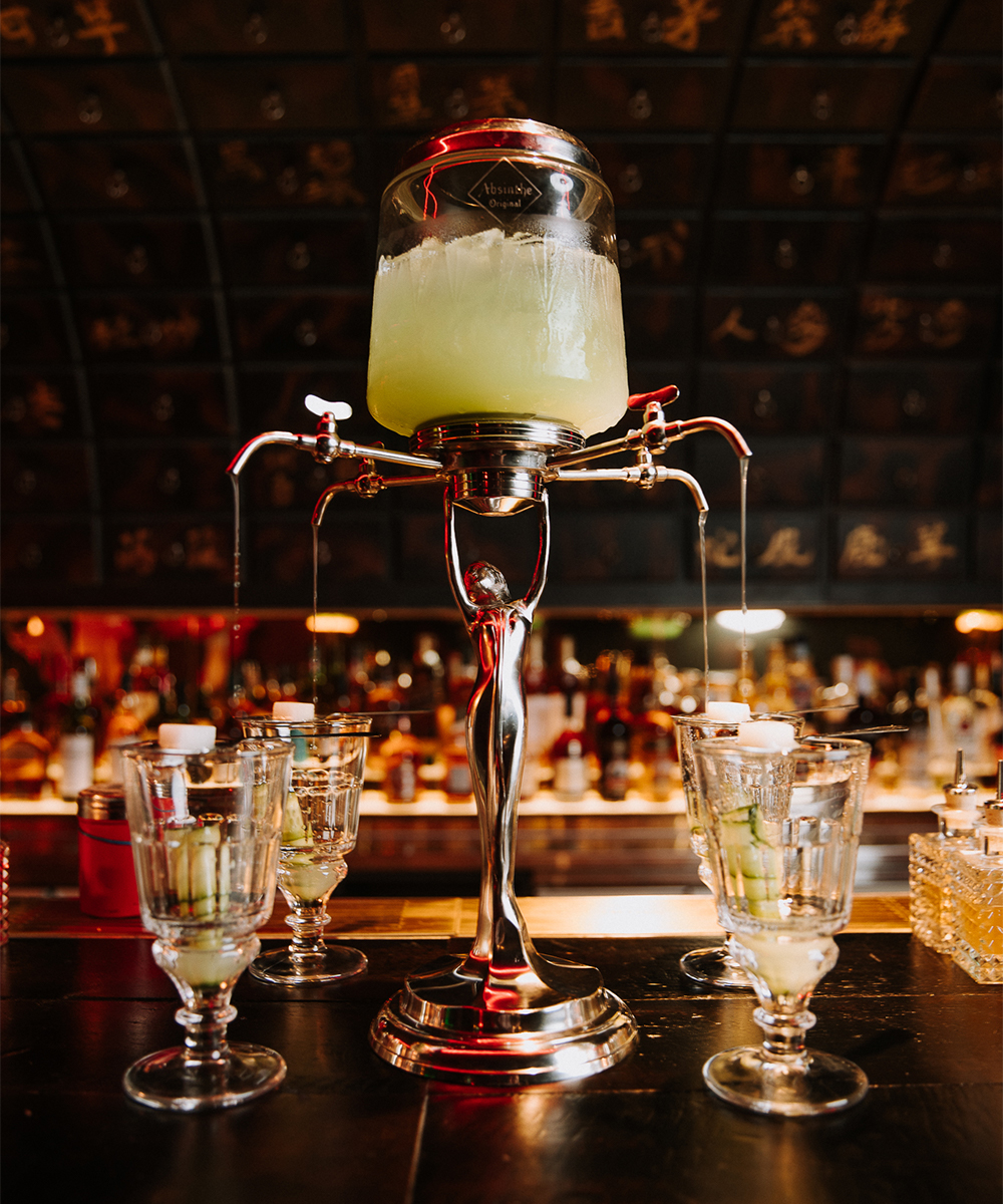 a cocktail tower filled with absinth