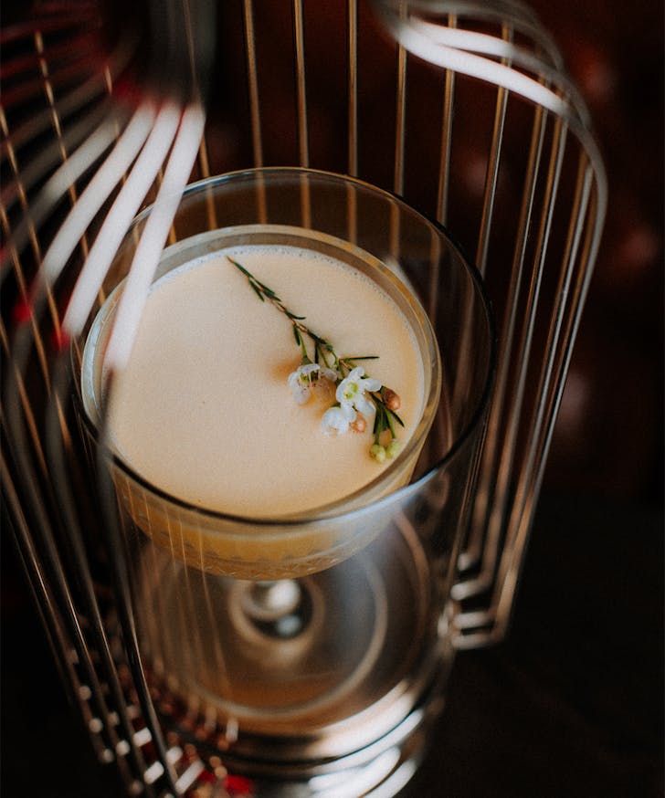 a cocktail in a cage