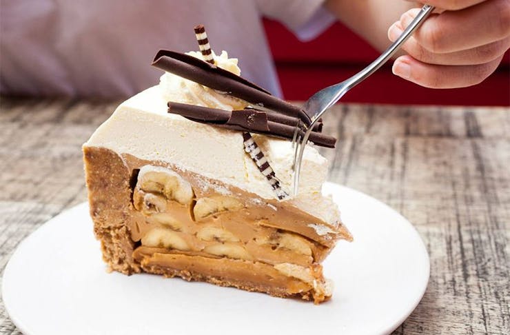 Someone slices into a delicious looking banoffee pie at Circus Circus.