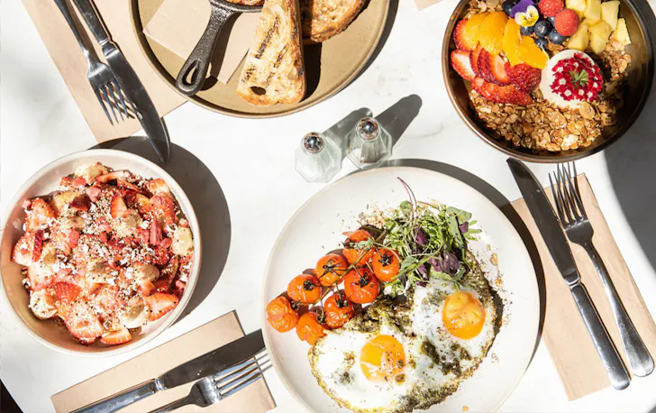 four breakfast dishes on a talbe