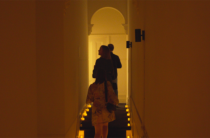 People walking up a staircase.