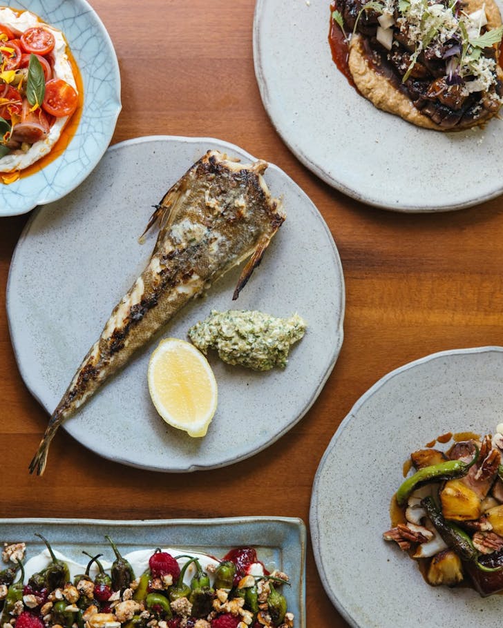 Various dishes and a whole fish from the menu at the Clareville