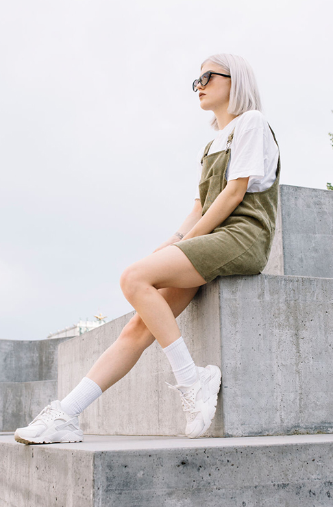 Girl sitting on a wall