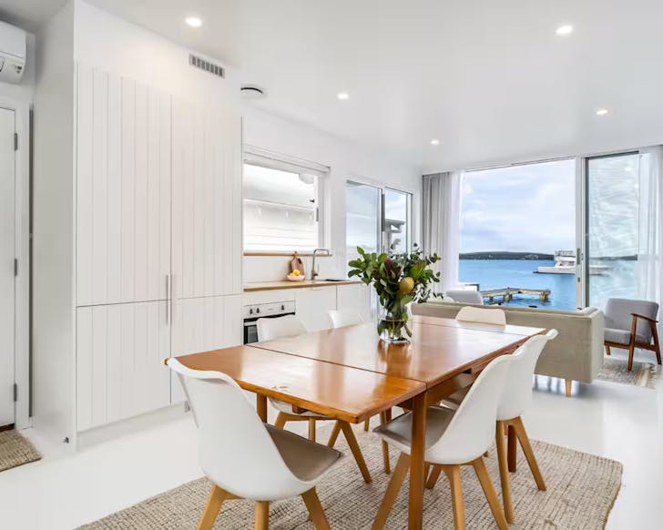 Dining room and kitchen at the lake house overlooking the water