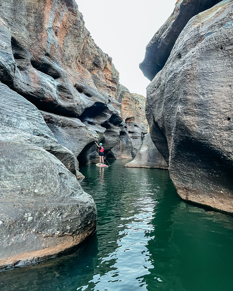 person on a sup in a gorge