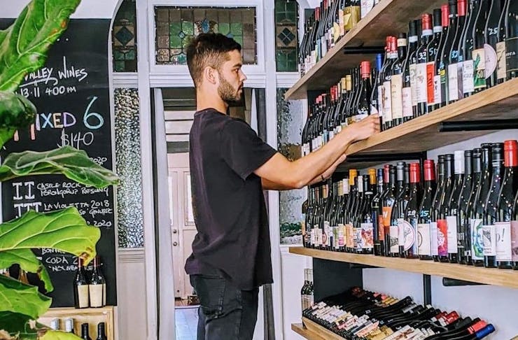 Person inside Commune Wine Store