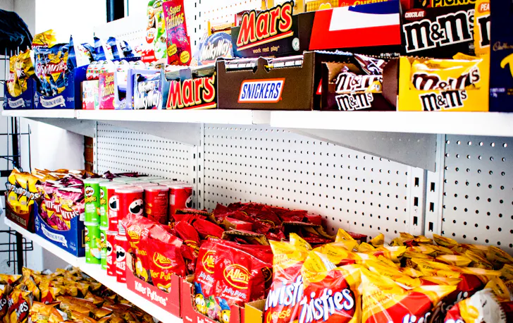 shelves filled with snacks at Convenients