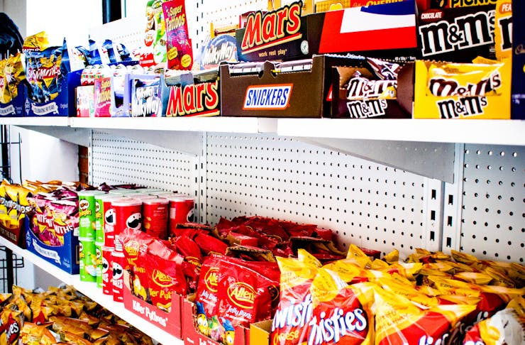 shelves filled with snacks at Convenients