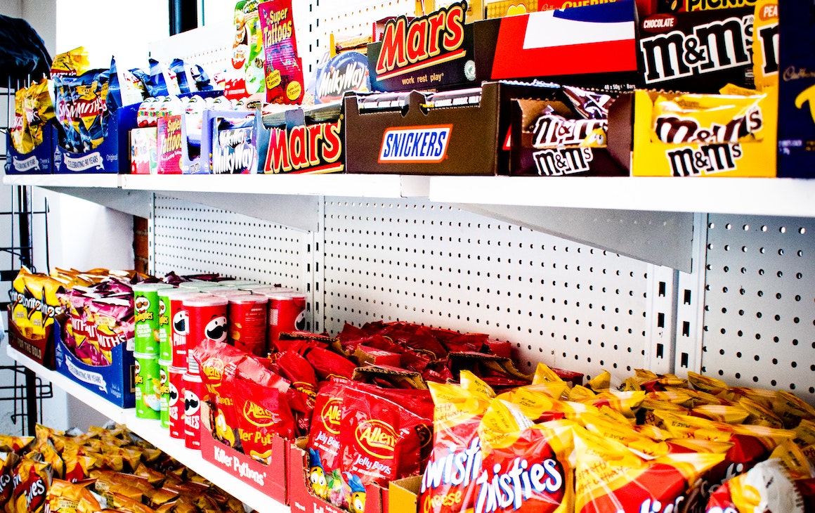 shelves filled with snacks at Convenients