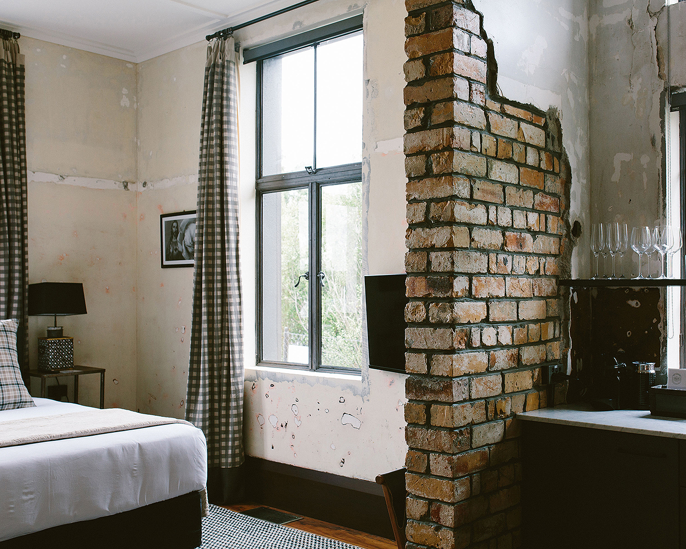 An exposed brick wall in a room at the Convent Hotel.