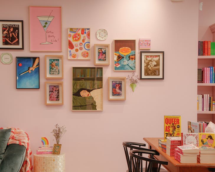 A cosy pink nook and green couch in Enamoured Books ookstore.