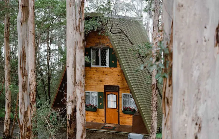 An exterior view of Treetops A-Frame best WA winter cabins and cottages