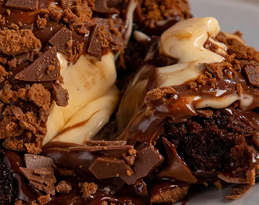 a chocolate dessert oozing with melted custard