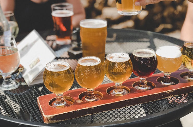 a tasting flight of beers on a table