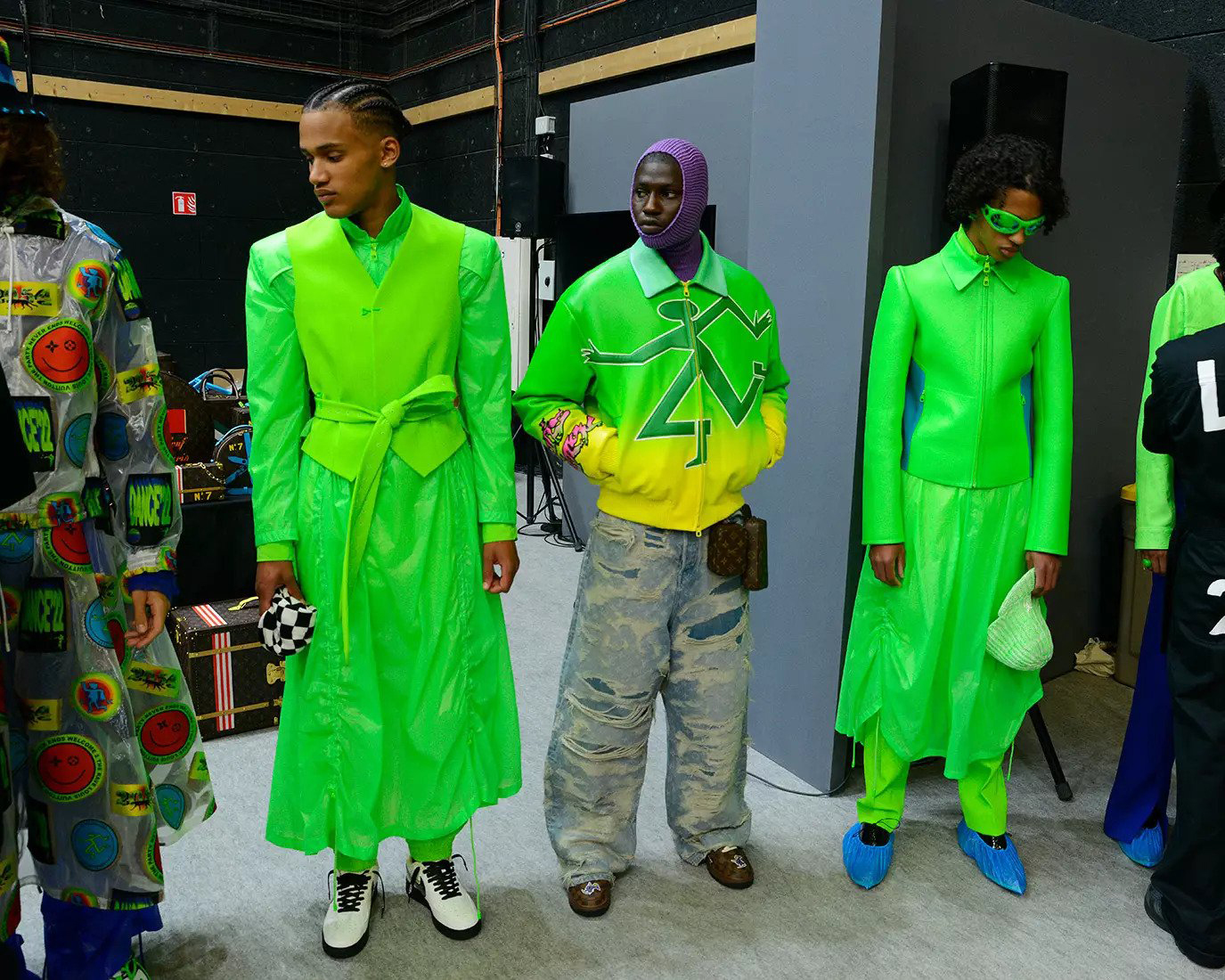 Models at Louis Vuitton wearing bright neon green