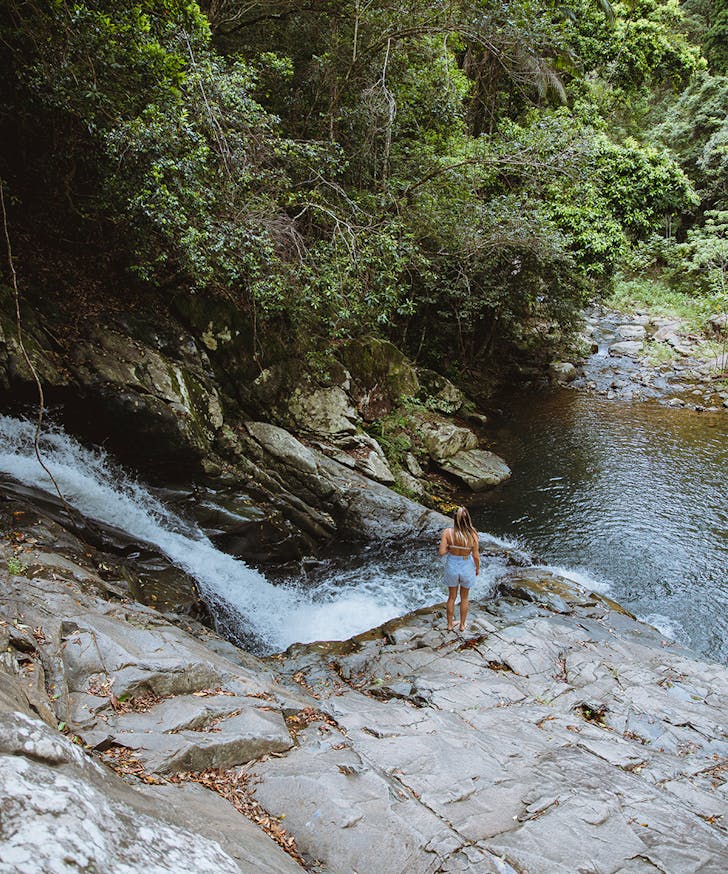 a waterfall tumbling into a rock pool