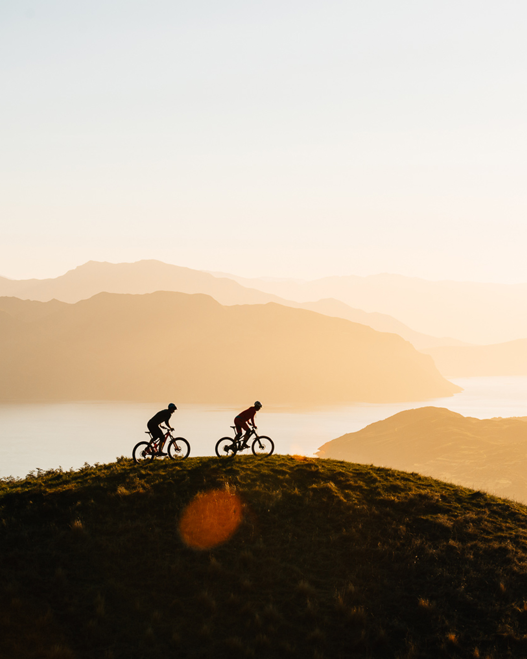 Bikers at sunrise in Wanaka