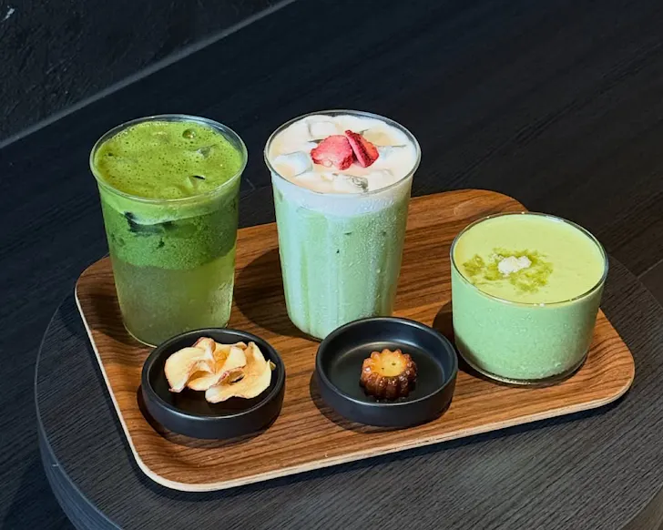 A tray of different matcha drinks and snacks.
