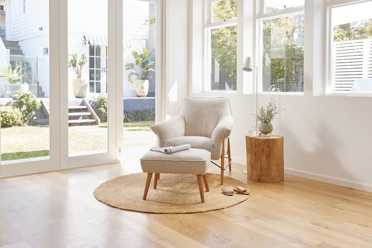 a white armchair in a sitting room