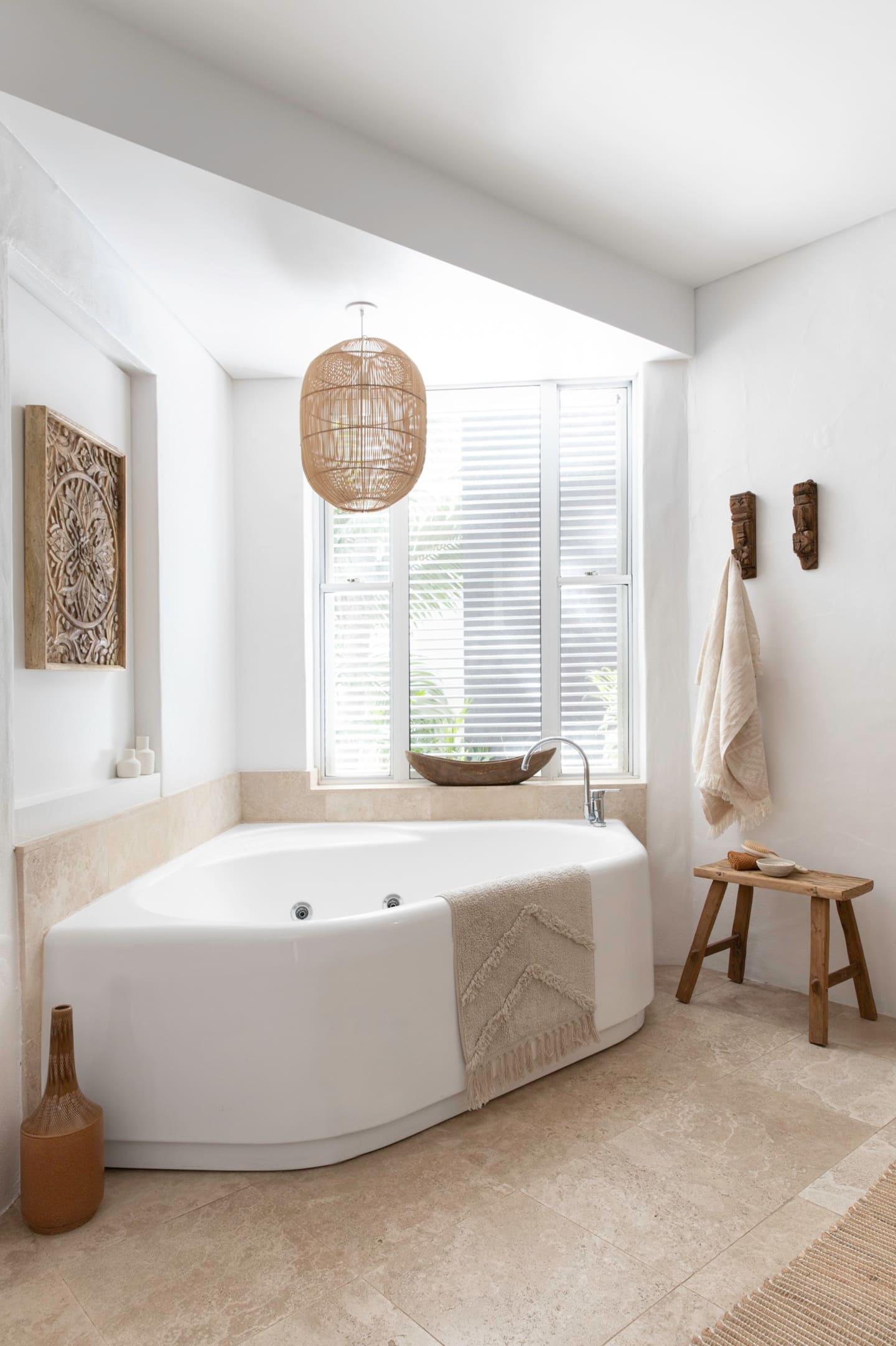 a spa in a bathroom with natural furnishings